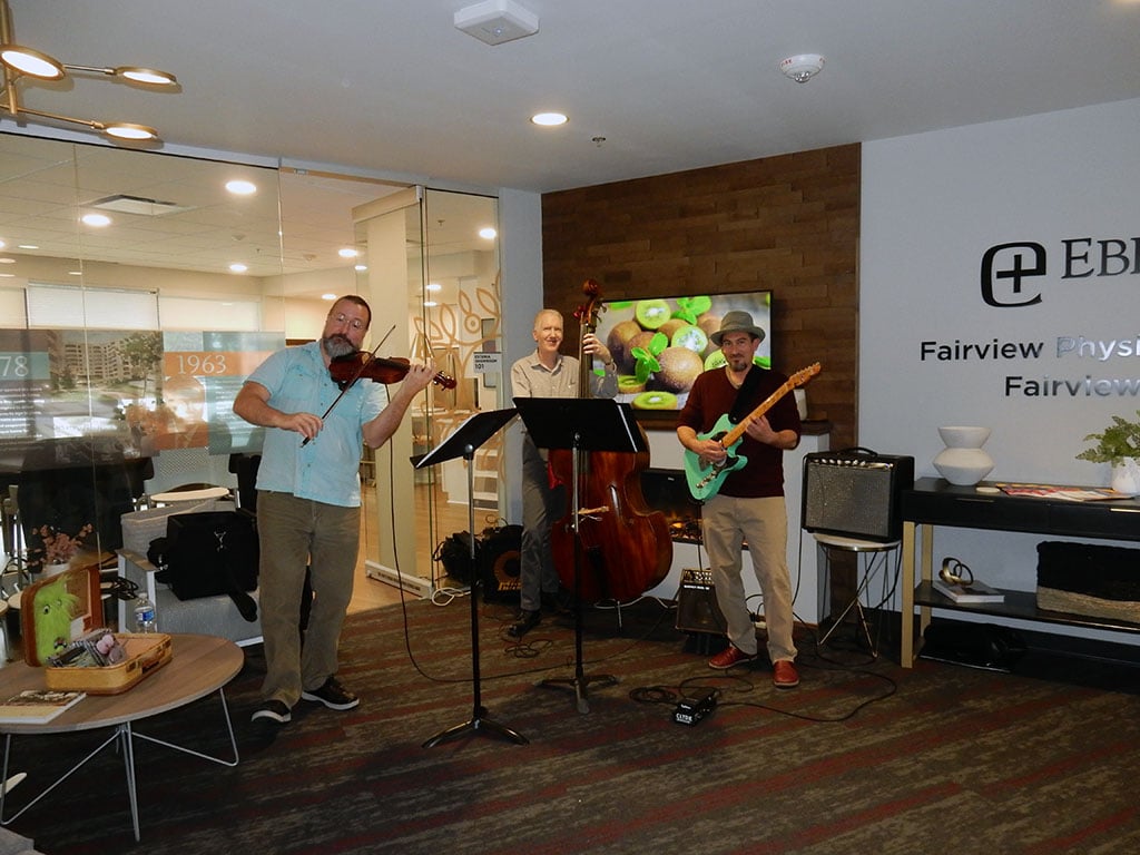 three man band playing music