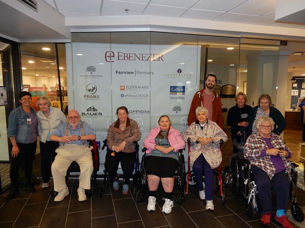 group of seniors visiting the ebenezer art show